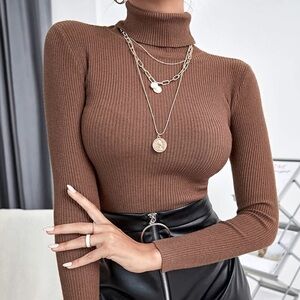 Cable knit sweater with high neck in Camel brown